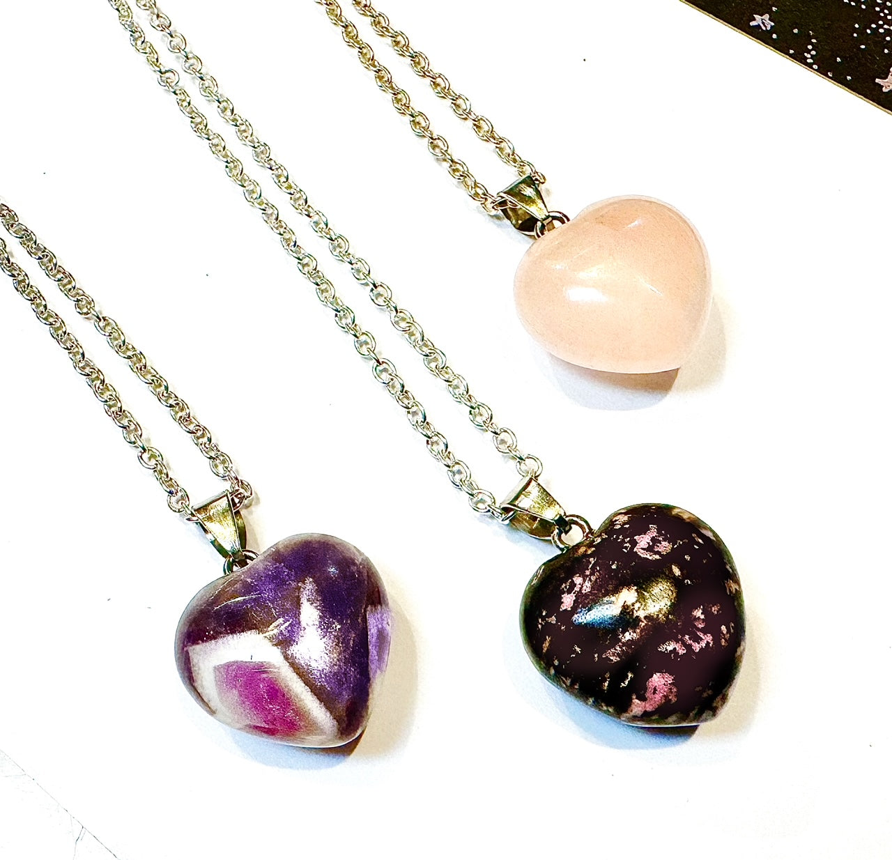Selection of Gemstone Heart Necklaces by Kinley Jewelry with Rose Quartz, Rhodonite and Dream Amethyst.