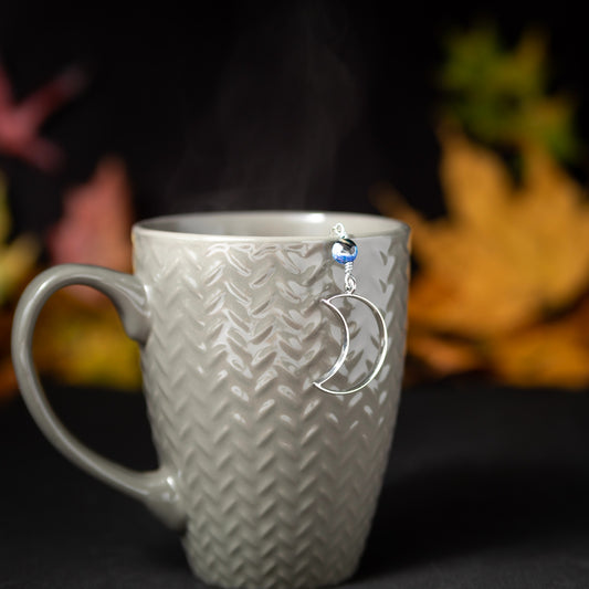 Goodnight Moon Charmed Tea Infuser – Silver Crescent Moon with Black and Blue Banded Agate Bead by Kinley Jewelry